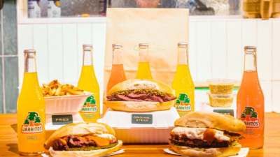 Steak sandwiches, burger, fries, and Jarritos drinks at BEAR Steak Sandwiches in downtown Toronto